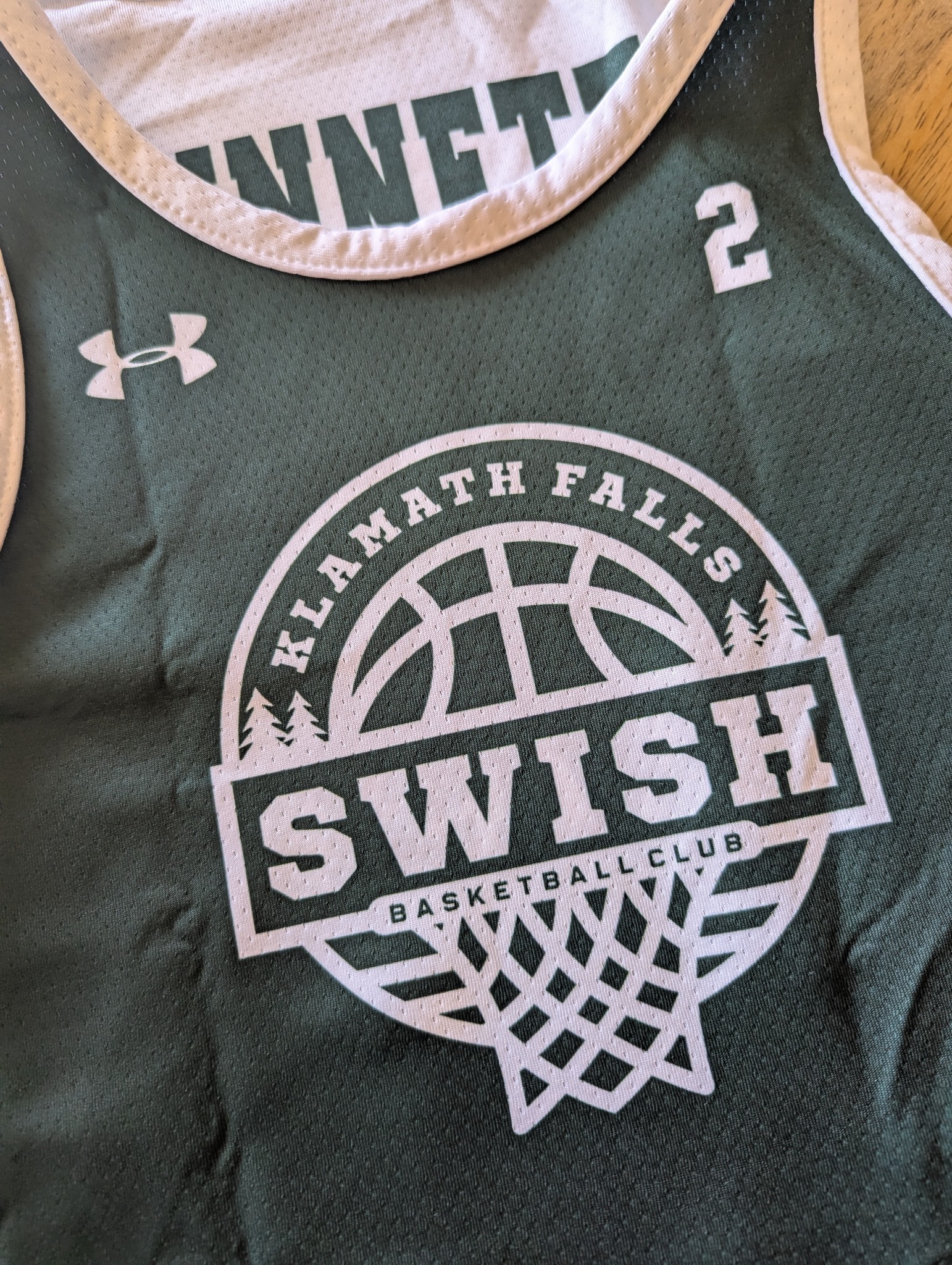 Klamath Falls Swish basketball uniform featuring the Swish logo